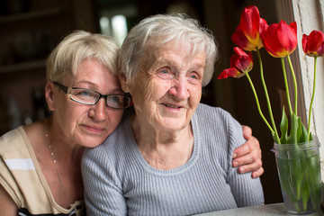 Happy grandmother with her adult daughter.