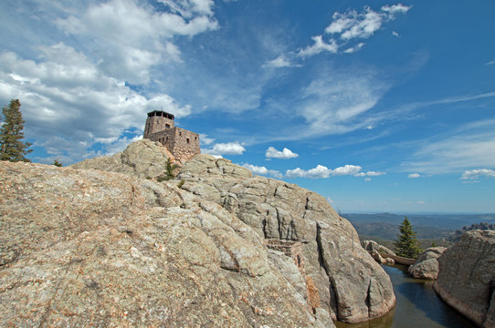 Harney Peak Fire Lookout Tower and pump house with small dam in Custer State Park in the Black Hills of South Dakota