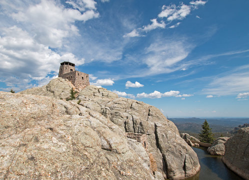 Harney Peak Fire Lookout Tower and pump house with small dam in Custer State Park in the Black Hills USA
