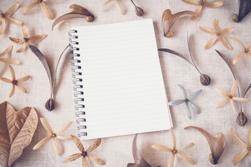 Notebook with flowers and seeds, Autumn toning background