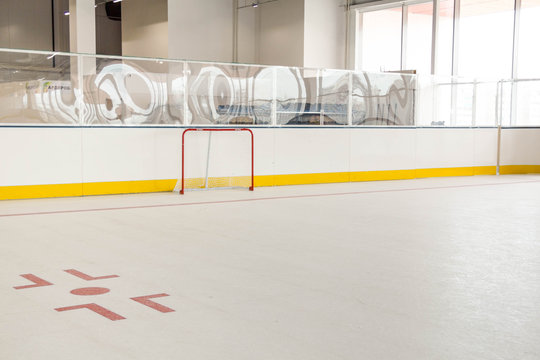 Red Line On Hockey Rink. Face Off Circle. Modern Empty .  Goal. Front View From Ice