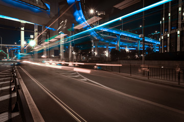 Fototapeta na wymiar Empty road floor with city elevated bridge of night