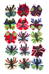 Бабочки из валяной шерсти на белом фоне
