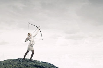 Woman aiming her goal . Mixed media