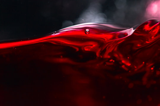 Fototapeta Red wine on black background
