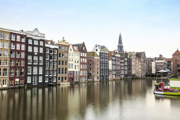 Fototapeta na wymiar Charming houses and canal in Amsterdam, The Netherlands