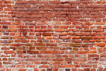 Old red brick wall background. 