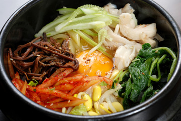 Rice with vegetable in hot bowl Korean food
