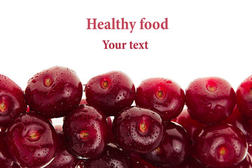  Heap of ripe cherries with water drops on a white background. Decorative frame of fruits. Isolated. Macro. Food background. Copy space.