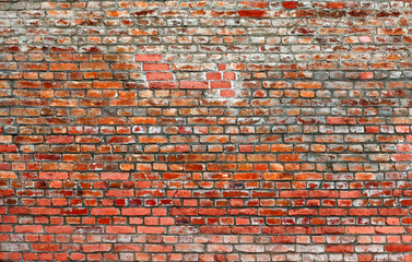 Old red brick wall background. 