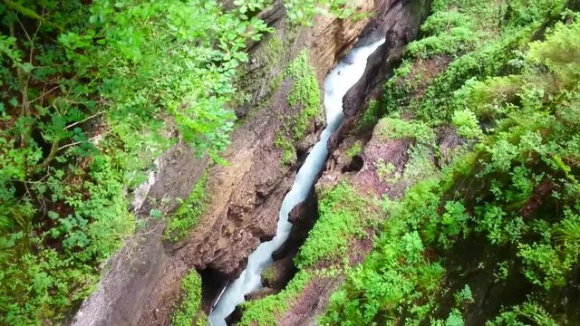 Aerial view and camera flight over rapids in Partnach Gorge or Partnachklamm is a scenic location and nature attraction in Germany near Garmisch Paterkirchen. 