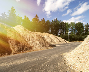 storage of wooden fuel against blue sky