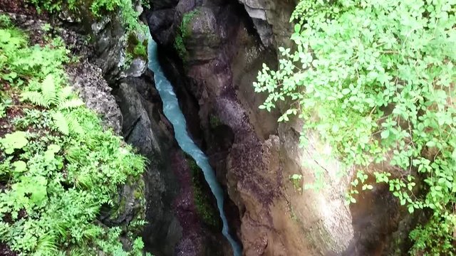 Aerial view and camera flight over rapids in Partnach Gorge or Partnachklamm is a scenic location and nature attraction in Germany near Garmisch Paterkirchen. 