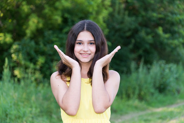 Young beautiful girl playing in nature