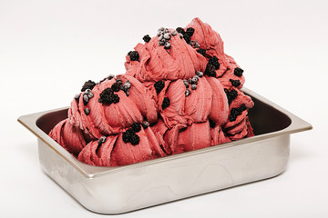 Blackberry and blueberry ice cream in the metal tray on white background