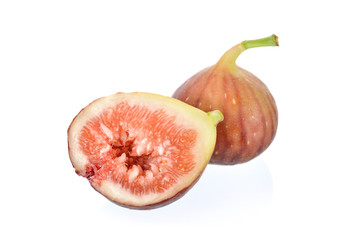 whole and half cut ripe fig with stem on white background