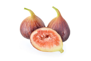 whole and half cut ripe fig with stem on white background