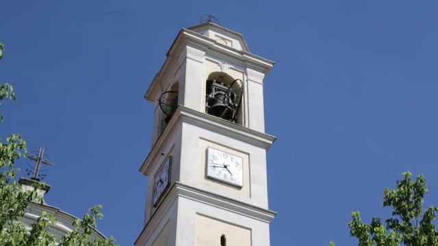 in italy vanzaghello  ancient   religion  building    for catholic and clock tower.