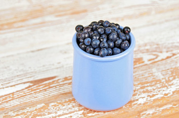 Fototapeta na wymiar Blueberry on wooden background.