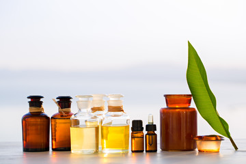 Spa oils in bottles on sunset