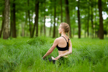 Naklejka na ściany i meble Medetation yoga session in woods