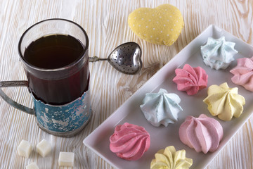 Meringue Cookies and glass of tea