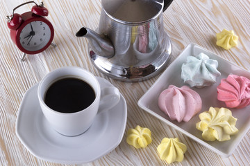 Meringue Cookies and cup of coffee.