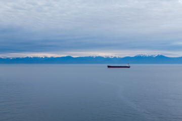 Fototapeta na wymiar Blue Alaskan Dawn with Freighter
