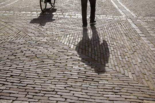 Fototapeta Cobble Stones, Cyclist and Pedestrian, Den Haag - the Hague  Hol