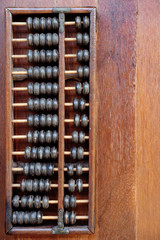 Vintage abacus on wooden background