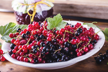 Red and black currants. red currant jam with fresh berry.