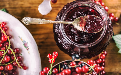 Red and black currants. red currant jam with fresh berry. © weyo