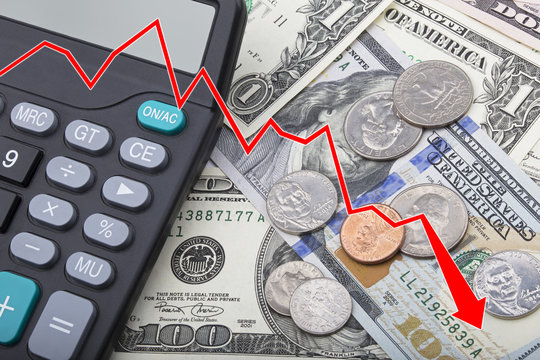 Graph showing USD bank notes with coins and a calculator