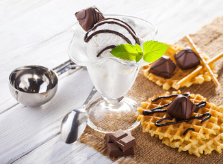 Ice Cream with chocolate candies, Mint and waffles.