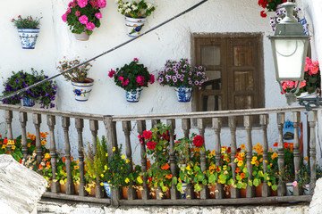 Fototapeta na wymiar House balcony with plantpots in Capileira