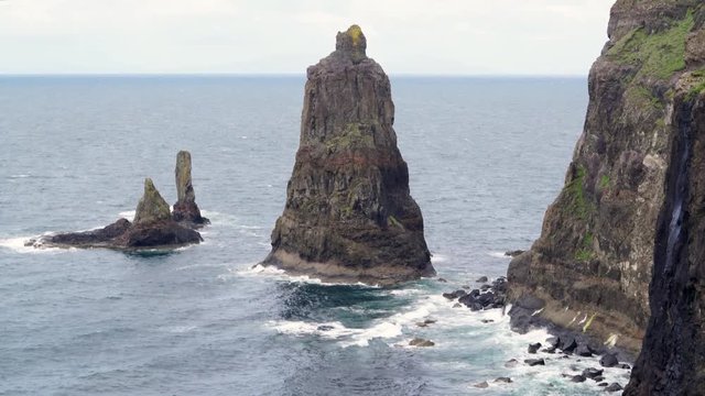 Waves breaking at the foot of Macleod's Maidens, Idrigill Point,  on the Isle of Skye, Scotland, UK.