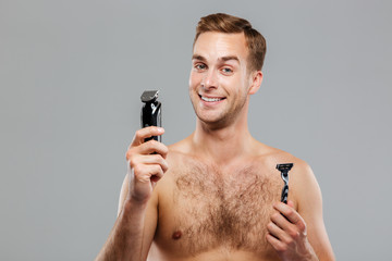 Young happy man what razor to choose