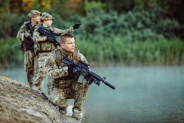 Special forces soldiers with weapon take part in military maneuv