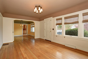 Empty living room interior with mocha ceiling and hardwood floor