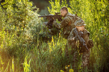 Special forces soldiers with weapon take part in military maneuv