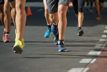 Fototapeta na wymiar Marathon running race, people feet on city road