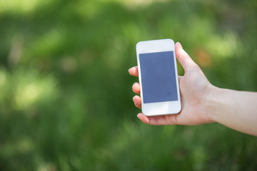Beautiful young woman at garden