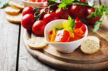 Italian sweet-sour paprika with bread and tomato