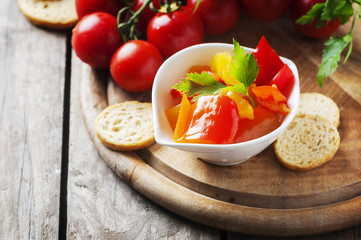 Italian sweet-sour paprika with bread and tomato