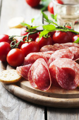 Fresh salami with tomato and bread