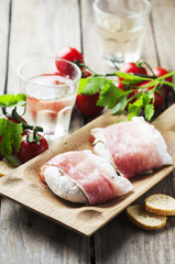 Traditional italian cheese tomino with bacon