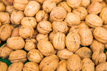 Pile of walnuts in their shells