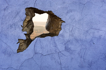 Blue concrete texture with a hole