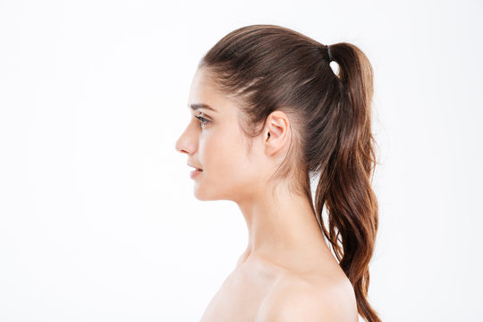 Profile of attractive young woman with ponytail