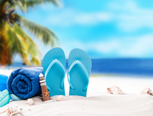 Summer concept, flip-flops, summer accessories on summer beach